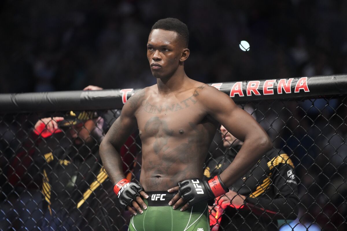 Israel Adesanya gets a tattoo on his face