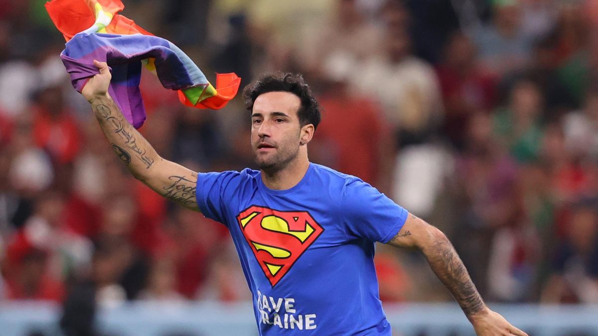 Field runner at FIFA World Cup 2022 Portugal vs Uruguay in a Save Ukraine T-shirt is an activist