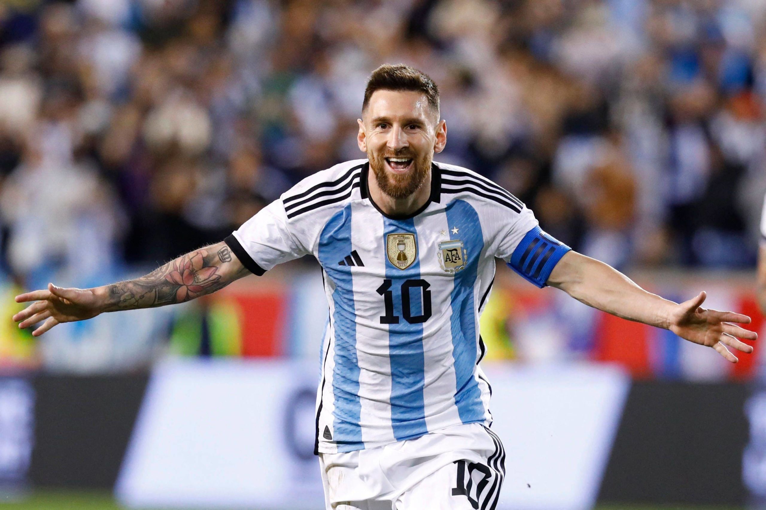 Messi captured kissing the World Cup trophy in Argentina's championship locker room