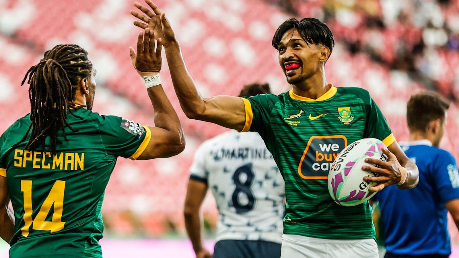 Tristyn Leyds and Rosco Specman celebrate during a sevens game